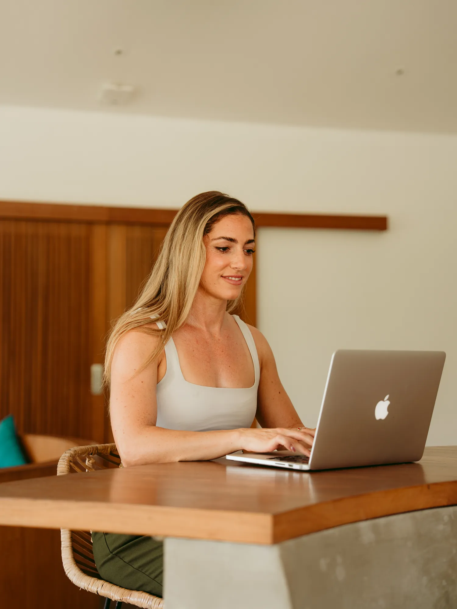 A guest working on a laptop at a desk in a private office