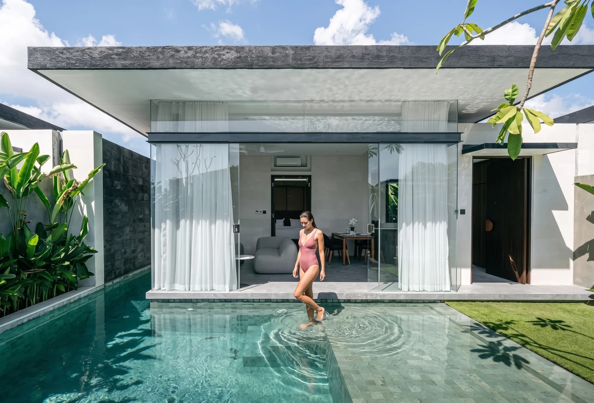 A guest stepping into the private pool of a one-bedroom Pronoia villa