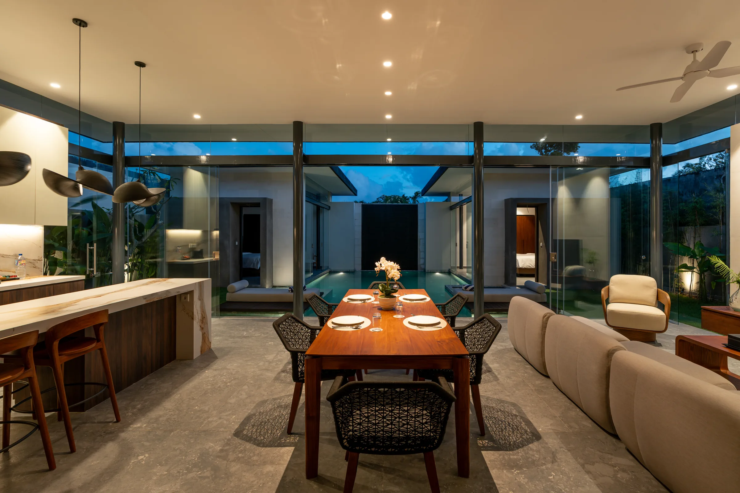 Open-plan living and dining area of the two-bedroom Pronoia villa overlooking its private pool.